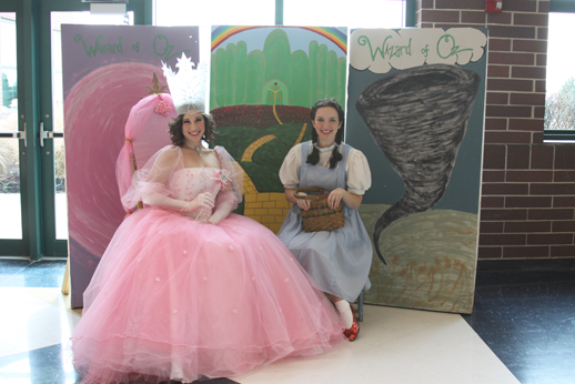 Seniors Hayley Barkoviak and Shelley Bushman (Glinda the Good Witch and Dorothy) wait for children attending the event to come and take their picture with them. 