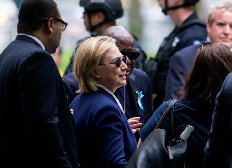 Clinton photographed at the 9/11 memorial before collapsing.
