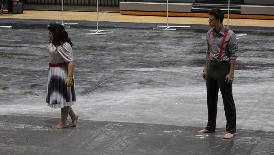 During a performance at Park Hill High School, members of Ruby Winter Guard perform to the song, Only Her Memories Remain.
