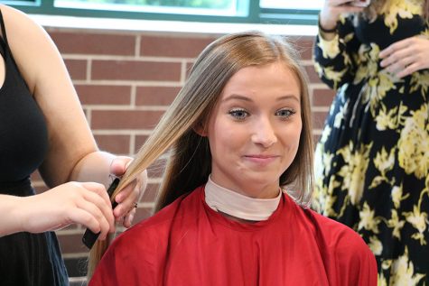 Junior Hannah Smith has more than 8 of hair removed and donated to make a wig for a child with pediatric cancer.