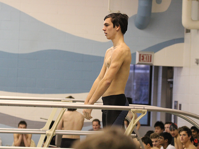 The Jaguars lone diver, junior Jake Seager prepares to start his first diver at the first meet of the season on Nov. 30.