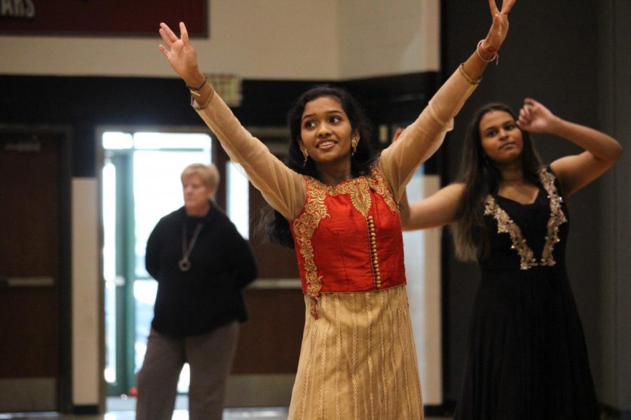 Junior, Ishana Tata waving her hands as the music plays dancing to a song at the Diversity Assembly January 26.
