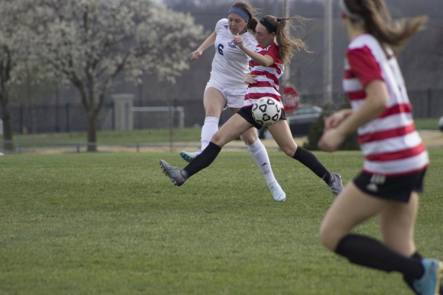 Sophomore Lindsey Kuhlamn kicking the ball as hard as she can to make a goal against BVN.