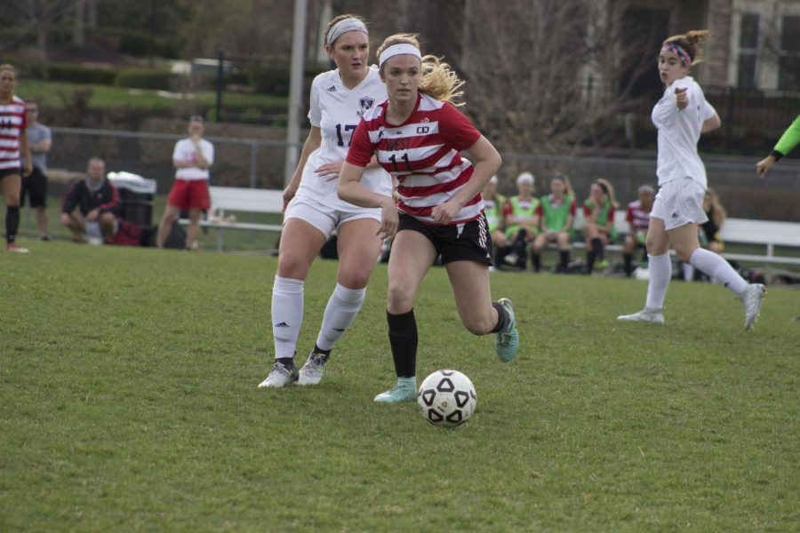 Liv Ensley with her eye on the goal, one of the few freshmen playing on Varsity. 