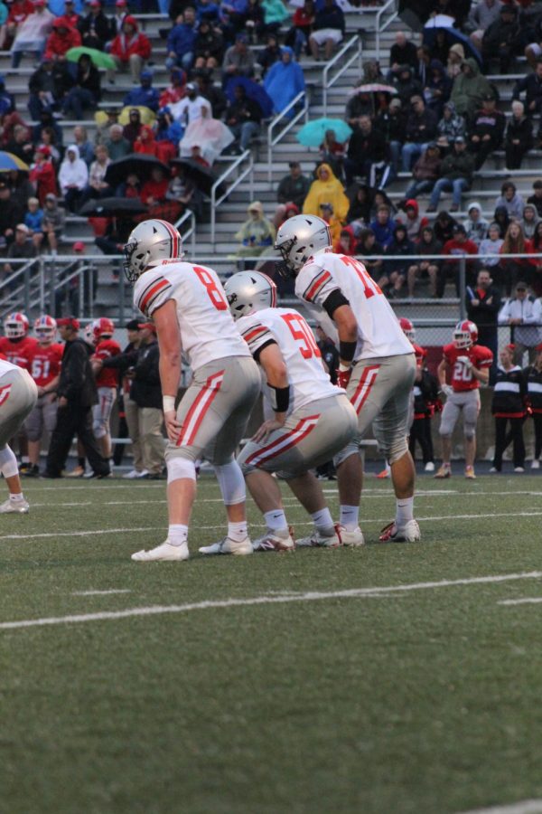 Triple Threat. Senior Ben Coates, Junior Logan Ford, and Sophomore Jared Patterson line up together to try to block a field goal in order to stop Miege from scoring. 