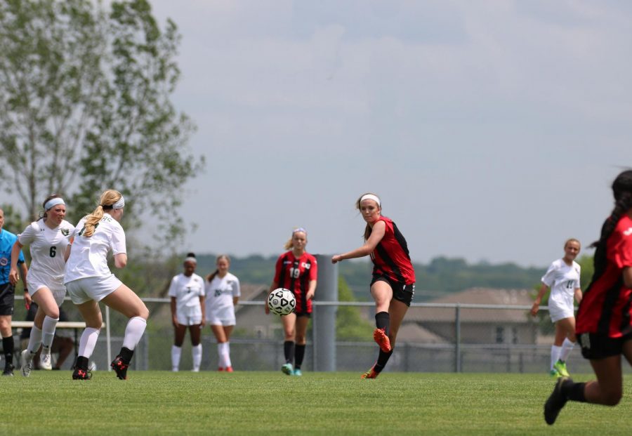 Liv Ensley passes the ball to a teammate and right passed two SM South players in the State quarterfinal game at the BV Antioch Dac on May 22.