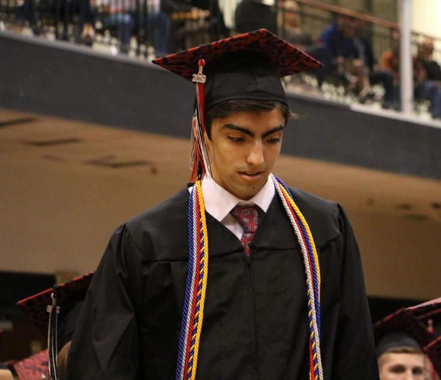 Senior Seena Saiedian makes his way to the stage for an award.