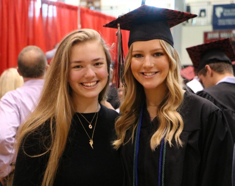Senior Lauren Lillis poses with friend sophomore Kenna Holland after Class Day.