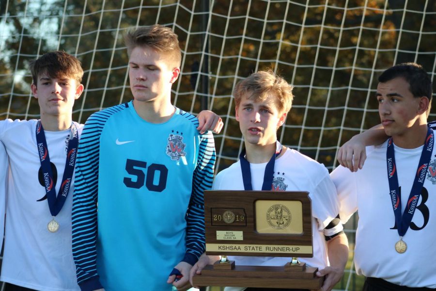 Proud of their State finals appearance by disappointed with the result, members of the BVW boys soccer team stand for pictures after awards were distributed.