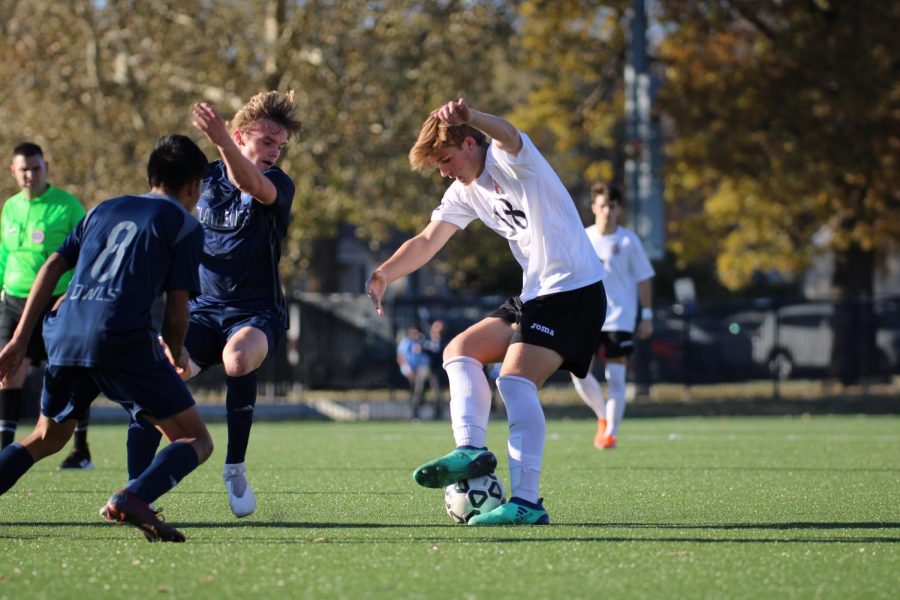 Looking more like a classical dancer than a soccer player, sophomore Kaden Cripe works the ball.