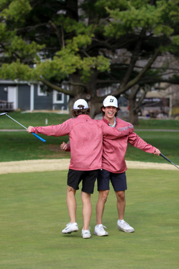 Sophomore Carter Eibes and duel partner Junior Nate Saporito celebrate after winning the hole at the Boys Gold duel vs. BV on Mar. 30