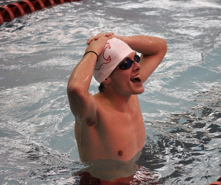 Junior Aiden Adair is ecstatic about his time during the Boys Swim and Dive Meet on Dec. 3 vs BVN