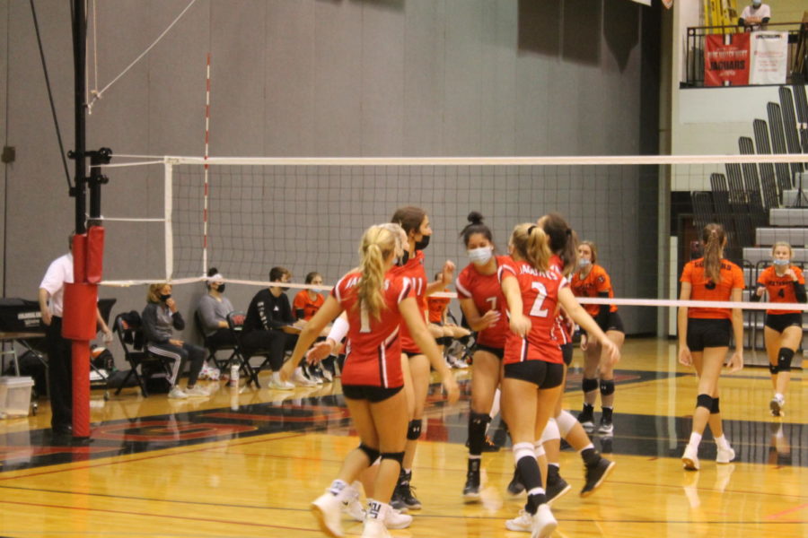 Varsity team celebrates after earning a point against the Olathe Northwest team on October 20th. 