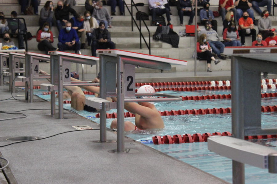boy swims the relay race during swim meet on January 22nd. 