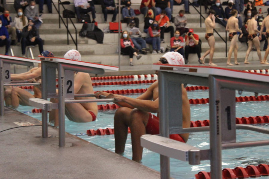 boy swims the relay race during swim meet on January 22nd. 