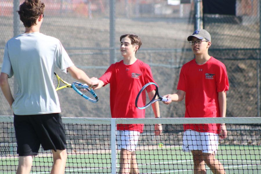 Kevin Zhao and Gage Sherron show goods sportsmanship to BVSW