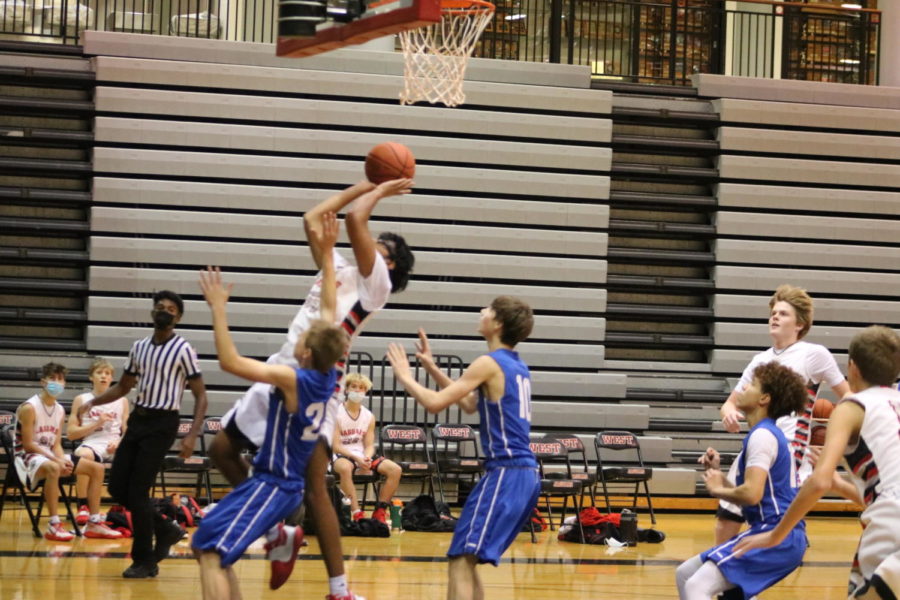 Vinay Shenoy goes up for a layup and scores the point.