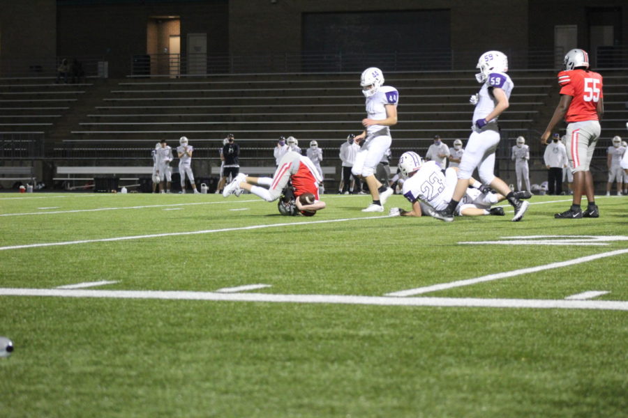 BVW JV football player Rolls to catch the ball.