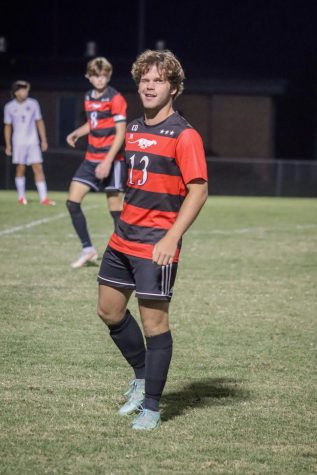 Senior Luis Masroua winks to the crowd as he subs into the game.