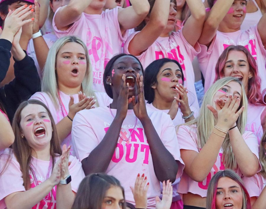 Junior Lily Ba cheers loudly for the BVW football team at the pinkout game.