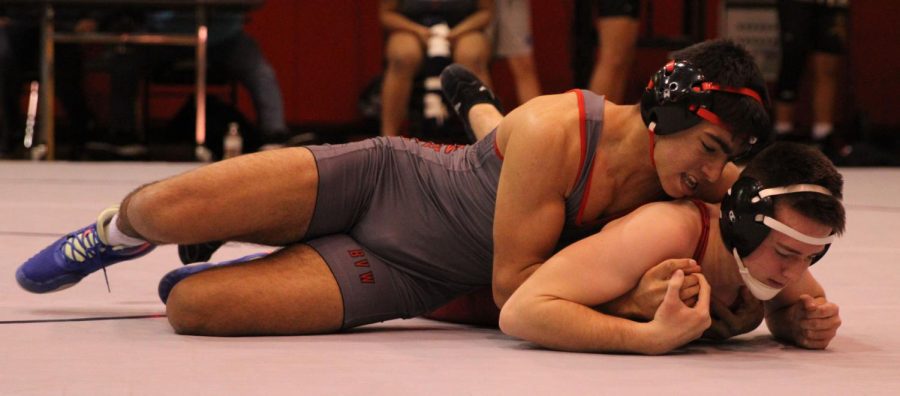 Senior+Mustafaa+Chapuk+pinning+his+opponent+down+in+his+second+match+of+the+night.+