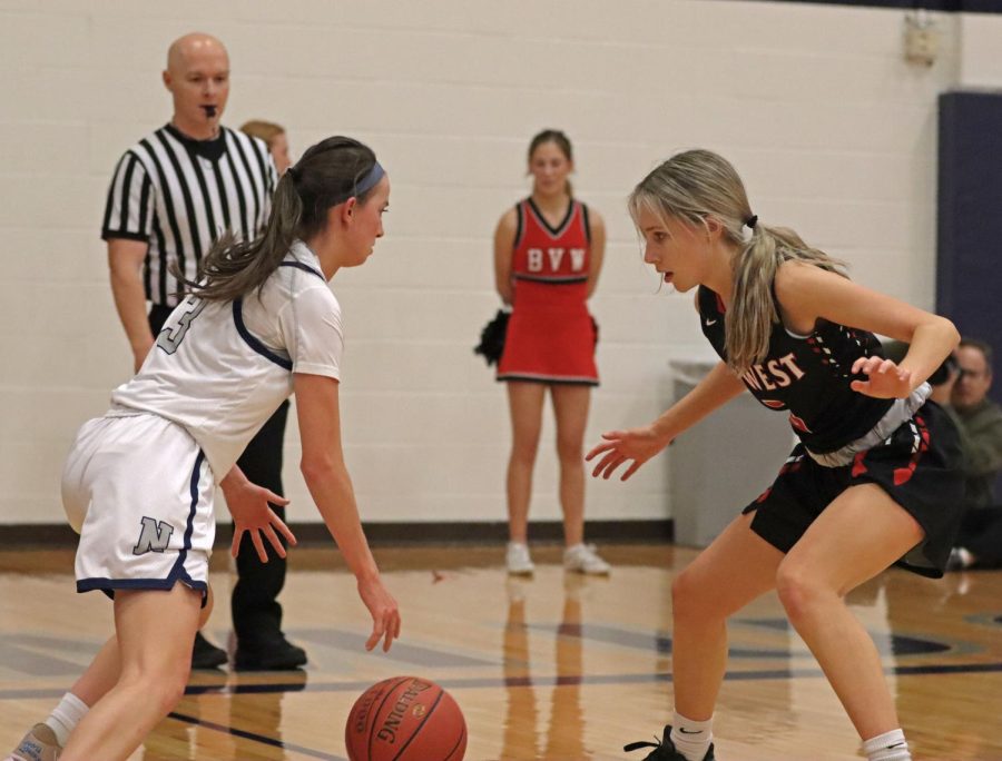 BVW Junior Lindsay Fritz guarding the basket from Blue Valley North player. The Varsity Girls Basketball team put up a fight against Blue Valley North on February 1st.
