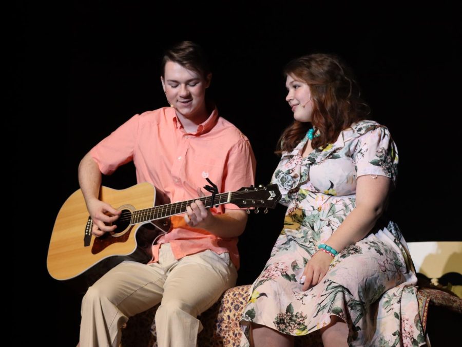 Serenading his costar with a song, senior Cooper Holmes performs effortlessly alongside sophomore Kennedy White at  the BVW production of Mamma Mia.