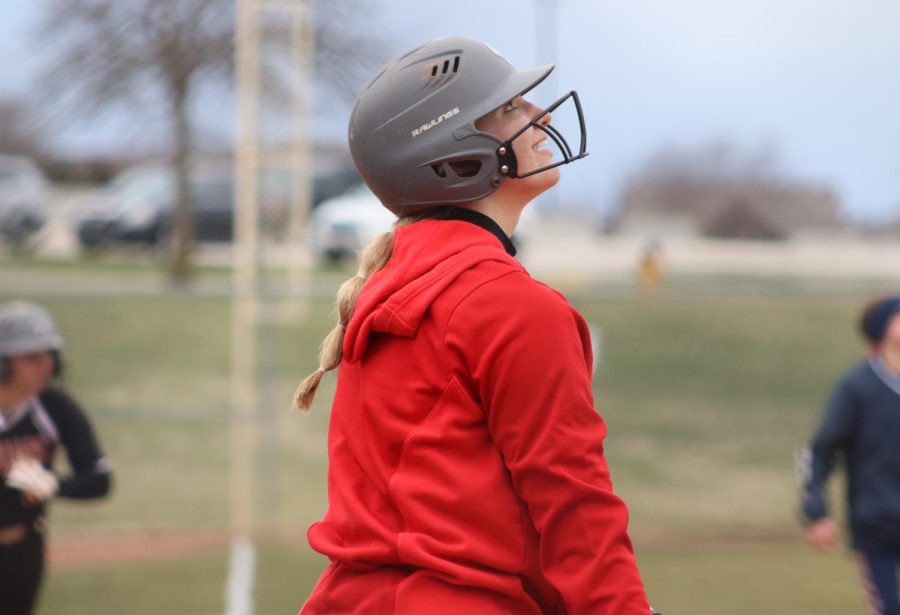 Sophomore Audrey Dryden proudly watches the softball fly through the air. 