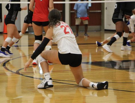 Libero Brookelyn Hatton gets up from a dig against Washburn Rural 9/13