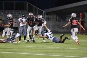 Number 6 Wayne Carter dodges opponents from BVSW in hopes to score a touchdown. 