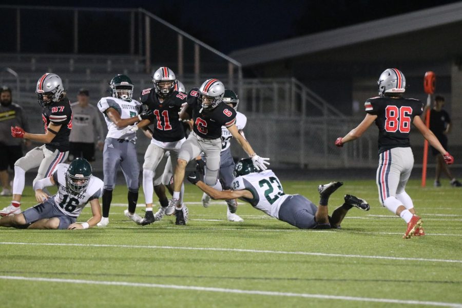 Number 6 Wayne Carter dodges opponents from BVSW in hopes to score a touchdown. 