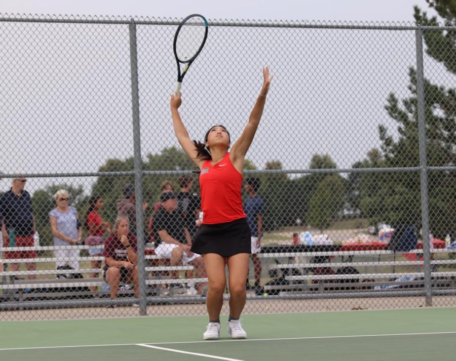 Ariel Chang winds up to serve to SJA. 