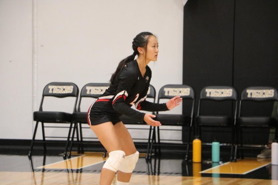 Sophomore, Lily Wang prepares to receive a serve. 