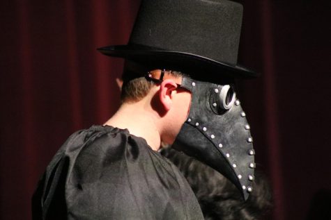 What a wicked costume! In this photo a student presents himself with a detailed Plague Doctor costume