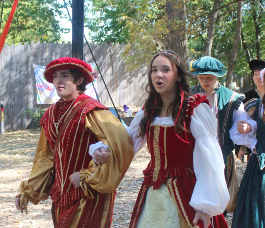 Seniors+Ellie+Vaughan+and+McCartney+Franklin+walking+off+after+singing+for+the+last+time+at+the+renaissance+festival.