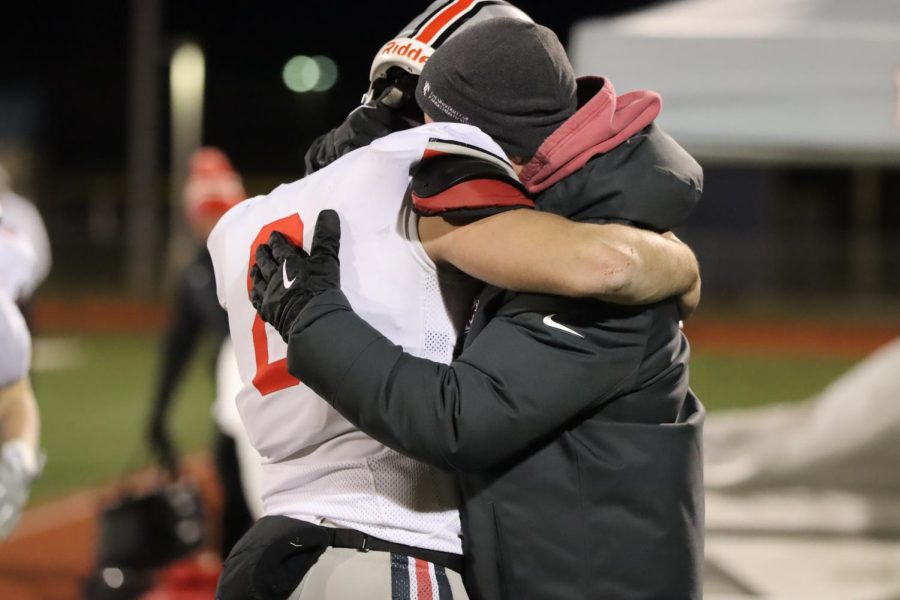 Senior Zach Darche hugging his dad after the jags lost to the trailblazers