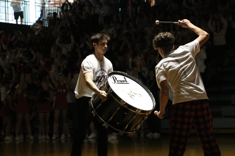 John Michael Pujado bangs the drum to continue the tradition at the beginning of the assembly.