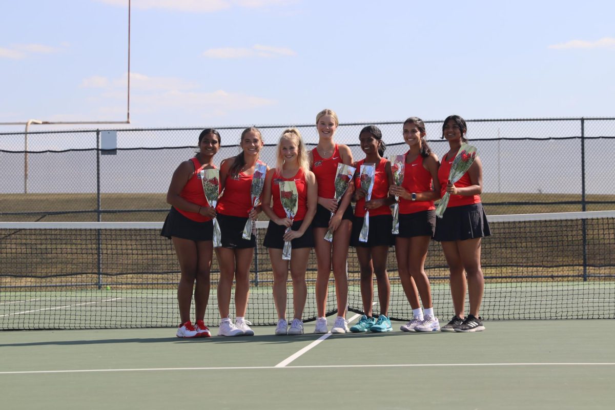 The senior girls line up together to celebrate their last tennis season together.