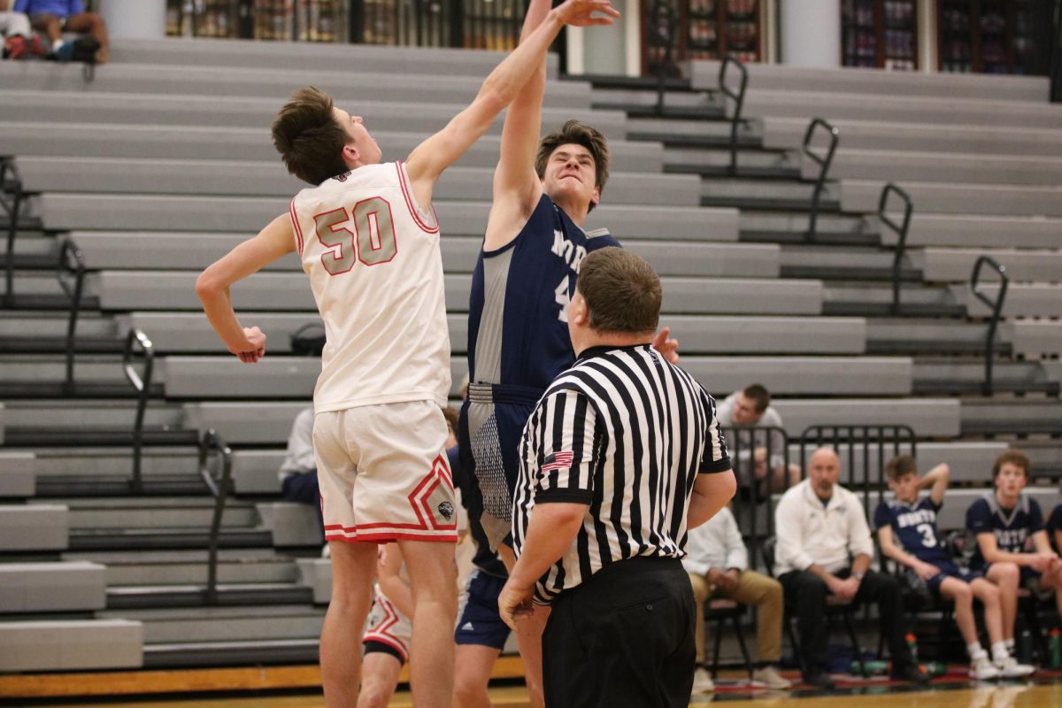 Freshmen Joseph Cromer attempts to block the shooter. 