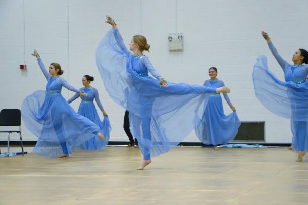 Blue Valley West winter guard performs their last show of the 23-24 school year to their family in friends