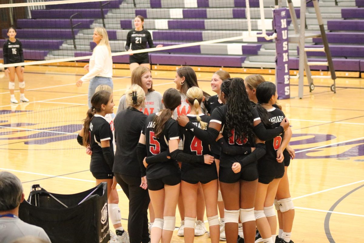 Freshman A Volleyball team talking before game starts. 