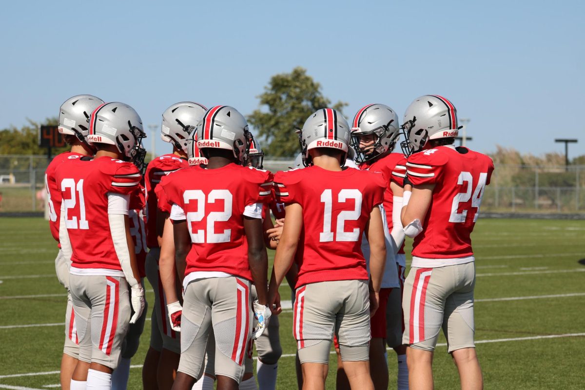 Small group meeting before going onto the field.