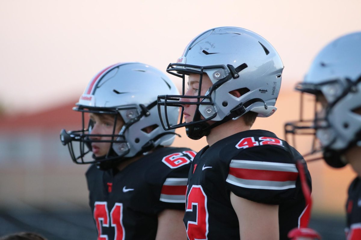 Sophomores Miles Hagan and William Layton watching their teammates play.