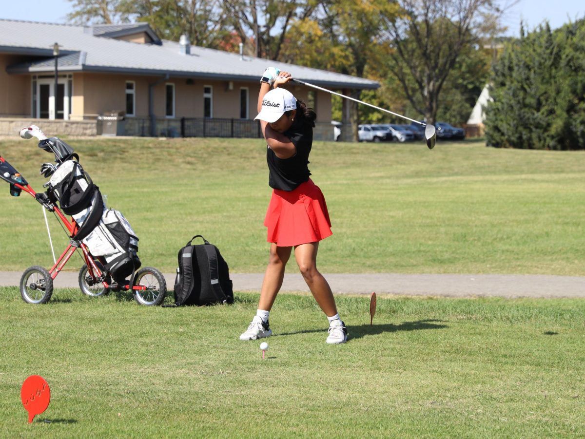 Sophomore Ashwika Balaji takes her first swing at hole number one of their tournament.