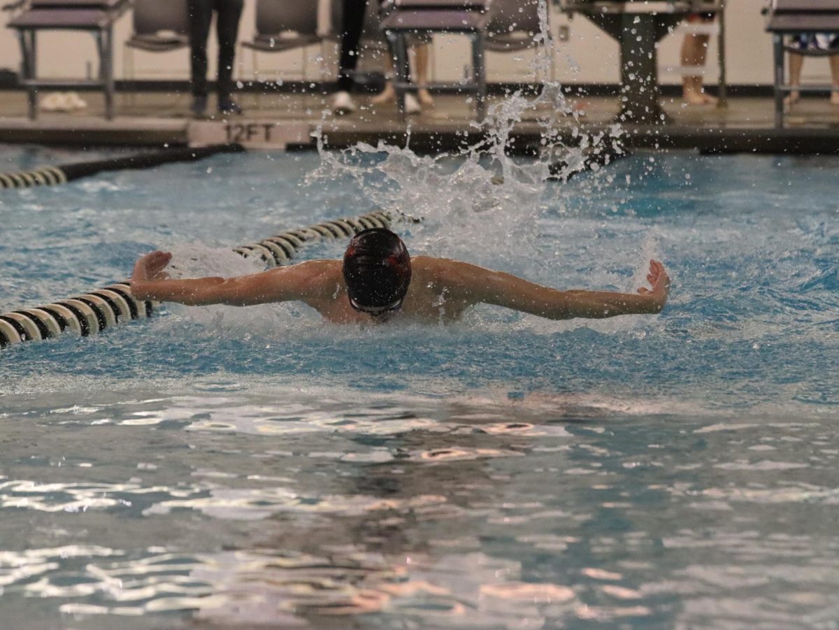 Senior Anthon Lumetta leads the 100 butterfly