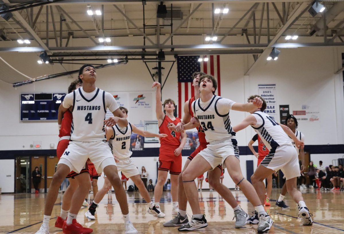 Lawson Mcgraw, a talented junior at BVW shoots and scores as he is crowded by the other team.